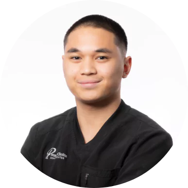 Male dental team member at Premier Choice Dental Center wearing a black scrub uniform.
