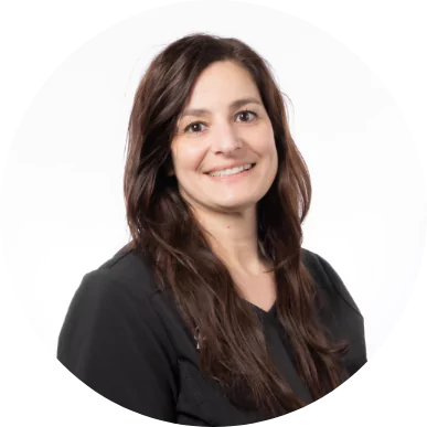 Female team member at Premier Choice Dental Center smiling in a black uniform.