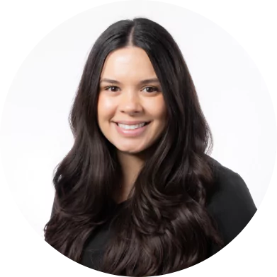 Smiling female dental staff member with long dark hair at Premier Choice Dental Center.