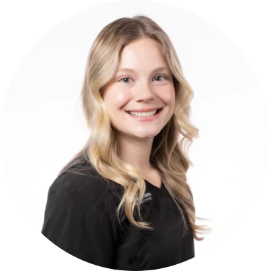 Smiling female dental assistant with long blonde hair at Premier Choice Dental Center.